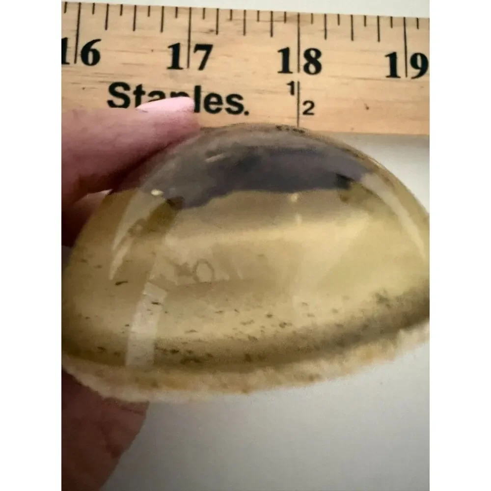 Vintage homemade paperweight with cloth or wood object